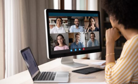 A virtual team works on their goals on a video call.